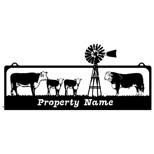 Bull, Cow, Calves with windmill Farm Sign